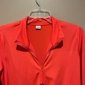 Land end zip-up. UPF 50+. Side pockets. Orange color. Size M.